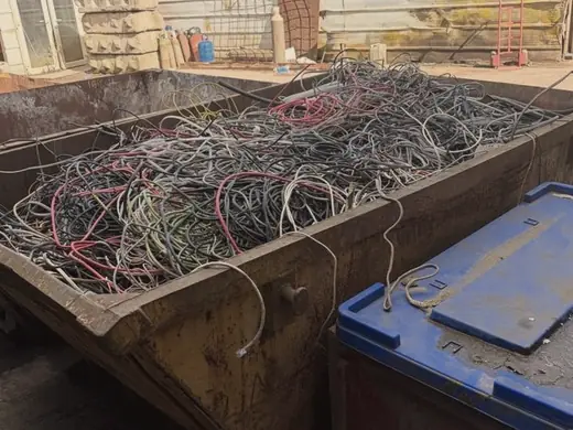 Skip filled with mixed cable ready for collection