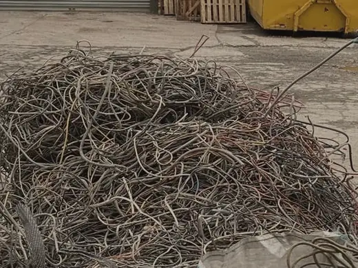 Large heap of armoured and mixed cable on a yard floor