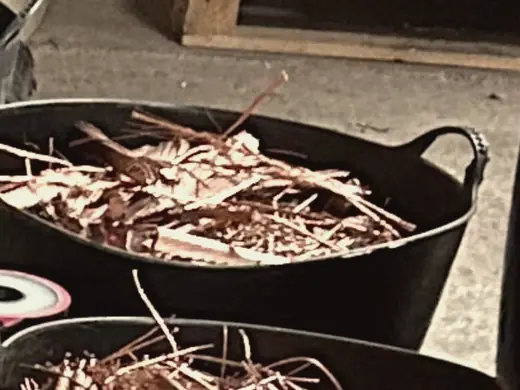 Tubs of bright copper wire recovered from granulated cable