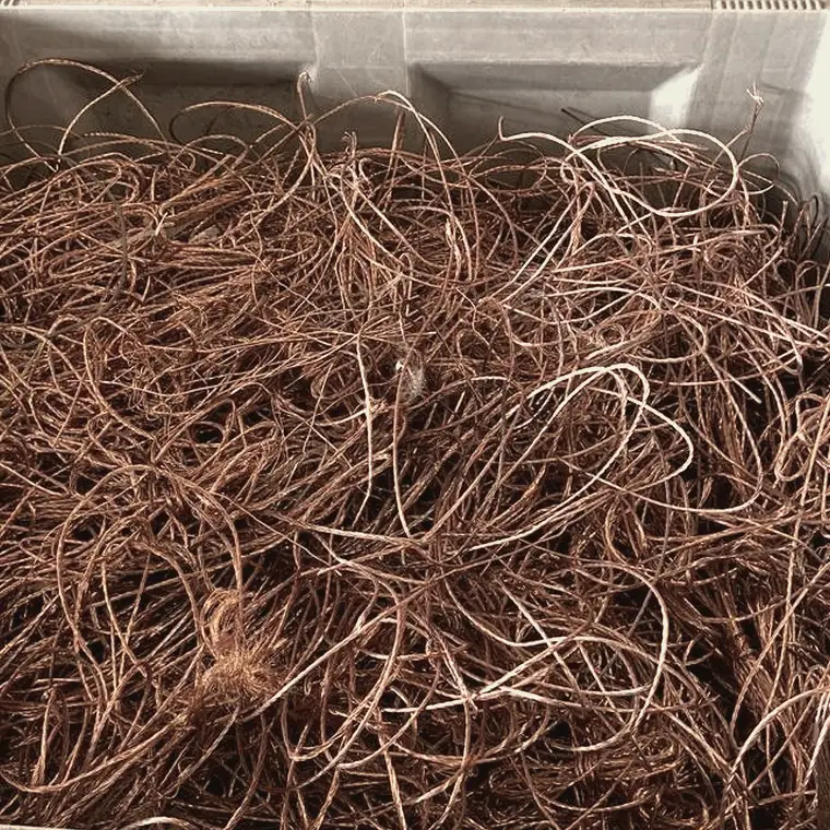 Dolav container filled with dry bright copper wire recovered from cable
