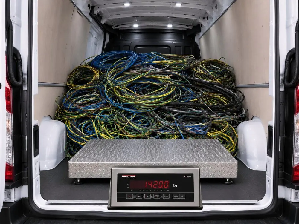 Platform scale set up in the back of a PMR van, weighing a load of stripped installation cable